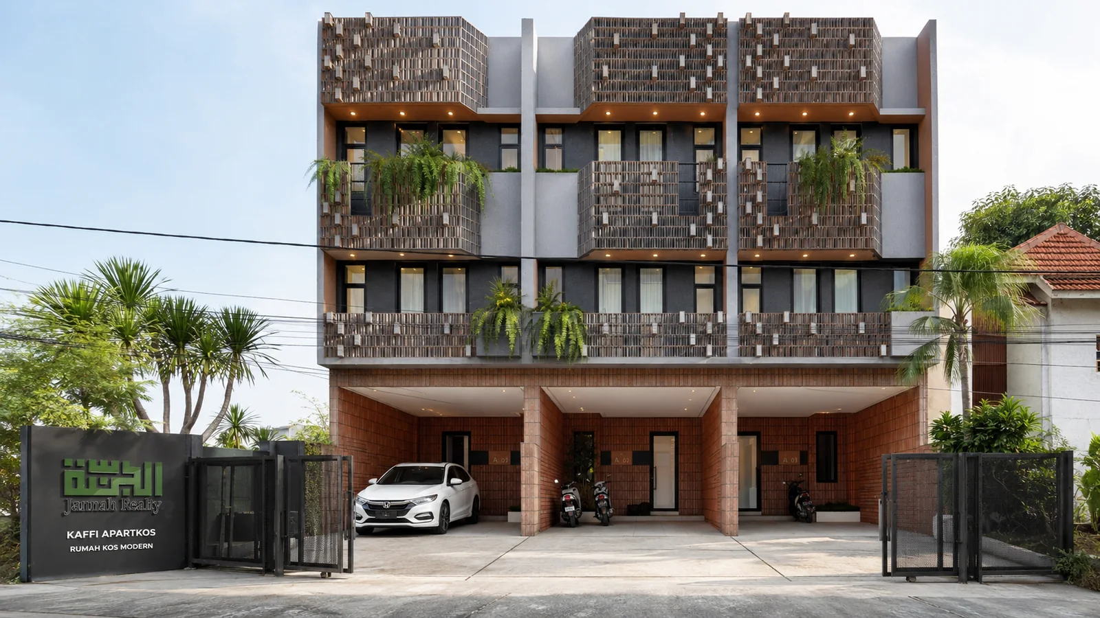 Fasad depan Kahfi Apartkos dengan area gerbang dan branding Jannah Realty di UI Depok