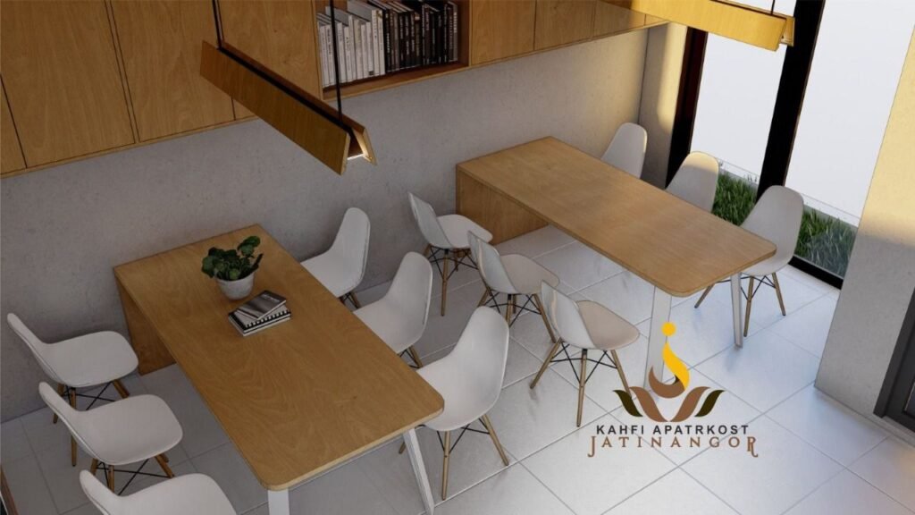 Render area komunal Kahfi Apartkost Jatinangor dengan meja panjang dan kursi belajar.