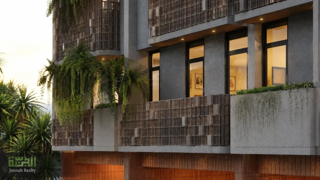 Detail balkon, roster, jendela hitam, dan tanaman gantung pada fasad Kahfi Apartkos.